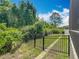 Fenced backyard with green grass, shrubbery and privacy offering space for outdoor activities at 1086 Calla Lily Cv, Oviedo, FL 32766