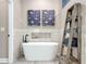 Bathroom featuring a free standing tub with black faucet and ladder display at 1086 Calla Lily Cv, Oviedo, FL 32766