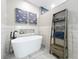 Bathroom featuring a free standing tub with black faucet and ladder display at 1086 Calla Lily Cv, Oviedo, FL 32766