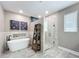 Contemporary bathroom with a freestanding tub, glass-enclosed shower, and decorative ladder at 1086 Calla Lily Cv, Oviedo, FL 32766