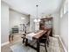 Spacious dining room featuring a large wooden table, a hutch, and an elegant light fixture at 1086 Calla Lily Cv, Oviedo, FL 32766
