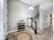 Welcoming entryway with staircase and decorative rug adding a touch of elegance at 1086 Calla Lily Cv, Oviedo, FL 32766