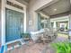Inviting front porch with rocking chairs and plants, creating a cozy and welcoming entrance to the home at 1086 Calla Lily Cv, Oviedo, FL 32766