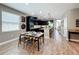 Modern kitchen with black cabinets, granite countertops, stainless steel appliances, and breakfast bar seating at 1086 Calla Lily Cv, Oviedo, FL 32766