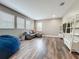 Cozy living room with ample natural light, comfortable seating, and modern entertainment center at 1086 Calla Lily Cv, Oviedo, FL 32766