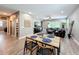 Open-concept living area featuring a dining table, and comfortable seating area with a ceiling fan at 1086 Calla Lily Cv, Oviedo, FL 32766
