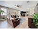 Spacious living room with comfortable seating, a ceiling fan, and tile floors at 1086 Calla Lily Cv, Oviedo, FL 32766