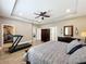 Spacious main bedroom features tile floors, tray ceilings, natural light, walk-in closet and ceiling fan at 1086 Calla Lily Cv, Oviedo, FL 32766