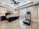 Spacious main bedroom features tile floors, tray ceilings, natural light, and a ceiling fan at 1086 Calla Lily Cv, Oviedo, FL 32766