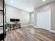 Home office with hardwood floors, a desk with dual monitors and white closet at 1086 Calla Lily Cv, Oviedo, FL 32766