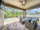 Screened in patio with view of the pool and backyard, features nice outdoor furniture at 1086 Calla Lily Cv, Oviedo, FL 32766