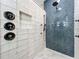 Detailed view of tiled shower with rain head and modern fixtures at 1086 Calla Lily Cv, Oviedo, FL 32766