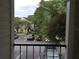 Balcony view overlooking a parking area and lush landscaping at 1089 S Hiawassee Rd # 323, Orlando, FL 32835
