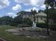 Beautiful building exterior featuring a decorative fountain and lush landscaping at 1089 S Hiawassee Rd # 323, Orlando, FL 32835