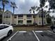 Inviting two-story condo building featuring private balconies and lush landscaping at 1089 S Hiawassee Rd # 323, Orlando, FL 32835