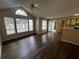 Bright living room featuring wood floors, high ceilings, and large windows at 1089 S Hiawassee Rd # 323, Orlando, FL 32835