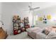 Bright bedroom with plush decor, built-in shelves and plenty of light at 1184 Fern Ave, Orlando, FL 32814