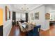 Chic dining room with seating for six, chandelier, and hardwood flooring at 1184 Fern Ave, Orlando, FL 32814