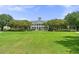 Classic building set amidst manicured lawns and mature trees offers a grand and stately presence at 1184 Fern Ave, Orlando, FL 32814