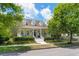 Charming two-story home with a cozy front porch, dormer windows, and a well-manicured landscaped yard at 1184 Fern Ave, Orlando, FL 32814