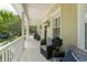 Inviting front porch with comfortable seating, charming columns, and stylish outdoor decor, creating a welcoming entrance at 1184 Fern Ave, Orlando, FL 32814