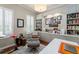 Stylish home office with built-in bookshelves, ample storage, and a comfortable chair, perfect for remote work at 1184 Fern Ave, Orlando, FL 32814