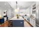 Beautiful kitchen with a large island, white cabinets, and stainless steel appliances at 1184 Fern Ave, Orlando, FL 32814