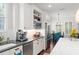 Contemporary kitchen featuring white cabinets, stainless steel appliances, and an island with seating at 1184 Fern Ave, Orlando, FL 32814