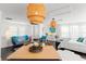 Open-concept living space with stylish furniture, large windows, and ample natural light at 1184 Fern Ave, Orlando, FL 32814