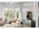 Bright living room with large windows, comfortable seating, and a modern design at 1184 Fern Ave, Orlando, FL 32814