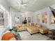 Inviting living room featuring a comfortable sofa, large windows, and a ceiling fan at 1184 Fern Ave, Orlando, FL 32814