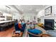 Open-concept living room featuring a fireplace, wood floors, and many windows for natural light at 1184 Fern Ave, Orlando, FL 32814
