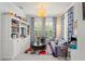 Bright living room with built-in bookshelves, large window and playful accents at 1184 Fern Ave, Orlando, FL 32814