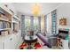 Cozy living room with built-in bookshelves, game machine and a round coffee table at 1184 Fern Ave, Orlando, FL 32814