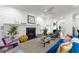 Inviting living room featuring a decorative fireplace, a ceiling fan, and comfortable seating at 1184 Fern Ave, Orlando, FL 32814