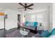 Bright living room features modern furniture and a view into the bathroom and kitchen at 1184 Fern Ave, Orlando, FL 32814