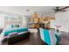 Open-concept living space combines living, sleeping, and kitchen areas with dark wood floors at 1184 Fern Ave, Orlando, FL 32814