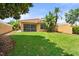 Lush backyard featuring a screened patio and tropical foliage at 11863 Delfina Ln, Orlando, FL 32827