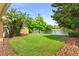 Beautifully landscaped backyard overlooking a peaceful lake at 11863 Delfina Ln, Orlando, FL 32827