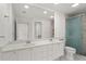 Bathroom with double sinks, updated vanity and shower at 11863 Delfina Ln, Orlando, FL 32827