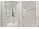 Bathroom and bedroom area featuring white cabinets and fixtures, and modern decor at 11863 Delfina Ln, Orlando, FL 32827