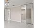 Bedroom featuring tiled flooring, closet, and a view to the kitchen at 11863 Delfina Ln, Orlando, FL 32827