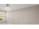 Bright bedroom featuring tile floors, neutral walls, and a window with natural light at 11863 Delfina Ln, Orlando, FL 32827
