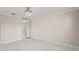 Bright bedroom featuring tiled flooring, closet, and modern light fixture at 11863 Delfina Ln, Orlando, FL 32827