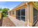 Enclosed patio with screened door and brick walkway at 11863 Delfina Ln, Orlando, FL 32827