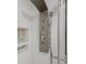 Close-up of a shower with wall jets and stone shelving in modern home bathroom at 11863 Delfina Ln, Orlando, FL 32827