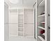This walk-in closet features custom shelving and ample storage space at 11863 Delfina Ln, Orlando, FL 32827