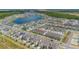 Extensive aerial view of a Primary planned community with an assortment of amenities and beautiful lake at 11944 Sunsail Ave, Orlando, FL 32832