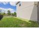Well-maintained backyard with lush green grass, black metal fence, and mature trees at 11944 Sunsail Ave, Orlando, FL 32832