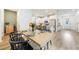 Open concept dining area with wood table, black chairs and view of the kitchen at 11944 Sunsail Ave, Orlando, FL 32832